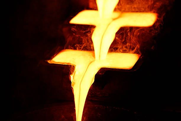 Molten gold being poured into casting molds